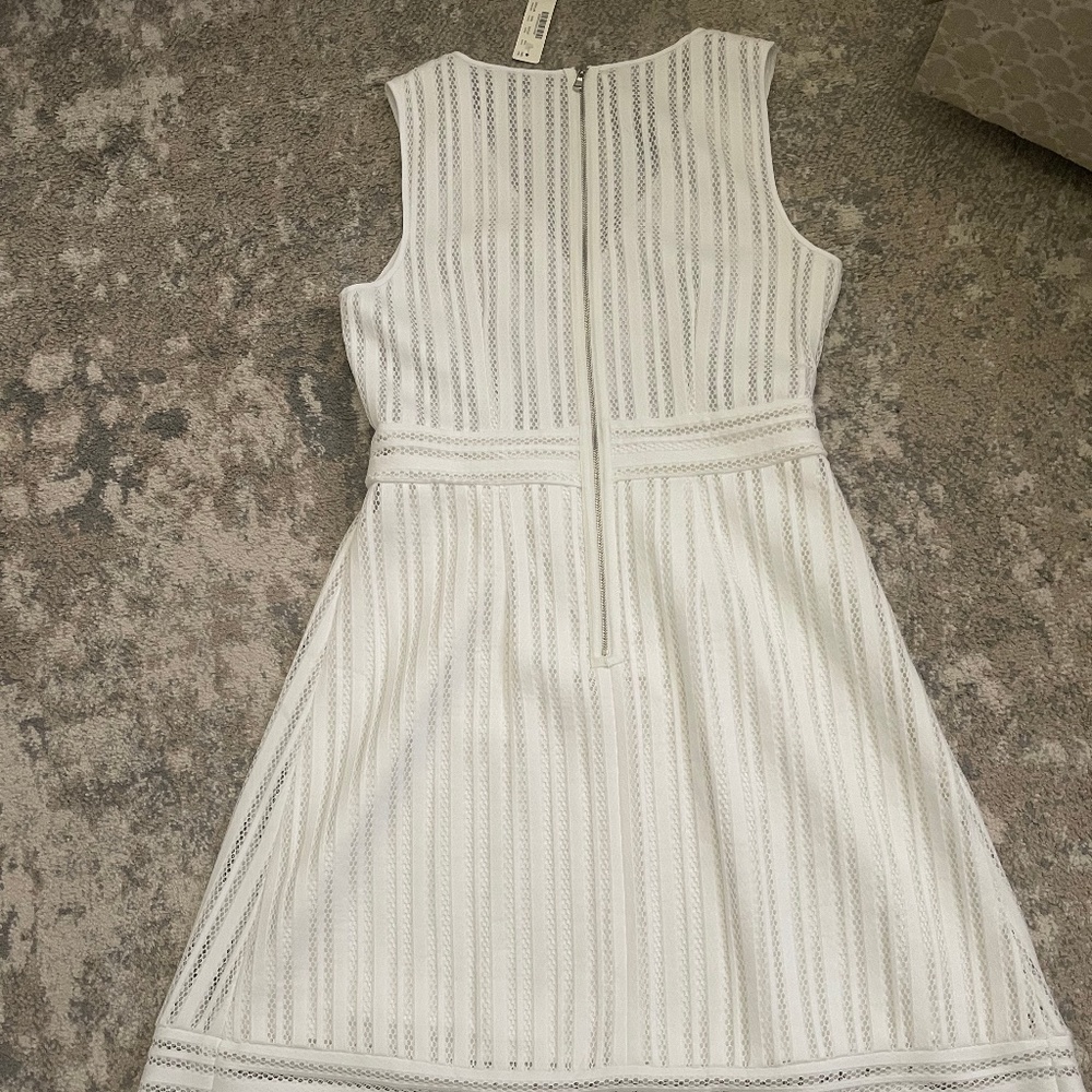 White, textured material, bodice/skirt dress.